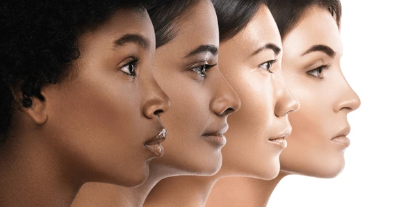 Side profile of four diverse women with different skin tones
