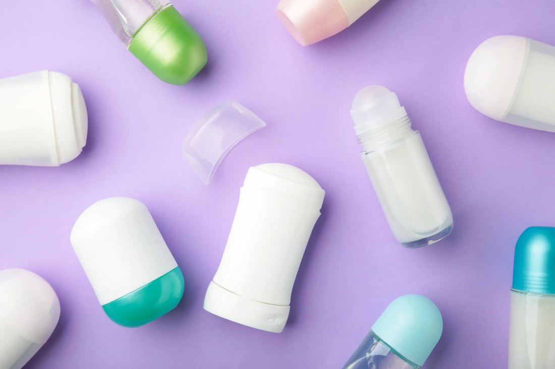 Various roll-on and stick deodorants in pastel-colored packaging