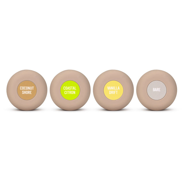 All four Roon caps in a row seen from above — Coconut Shore, Coastal Citron, Vanilla Drift and the plain grey Bare