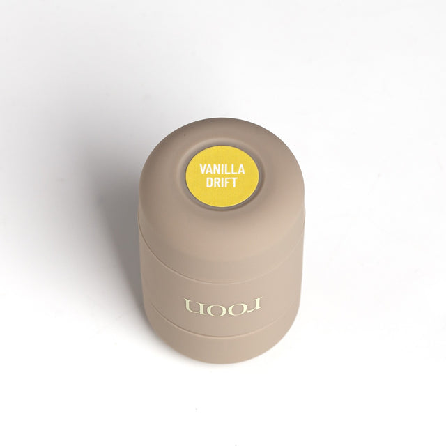 A single Roon mini deodorant tube standing upright, scent dot on the cap